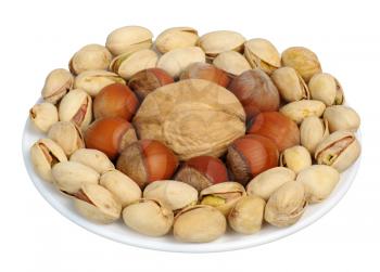 Pistachios, walnuts, hazelnuts on a white background, isolated