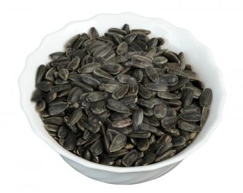 Sunflower seeds in a plate on white background, isolated