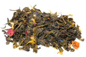 Green tea with flower petals and spices on a white background.