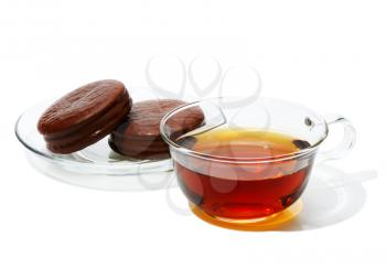 Black tea in a glass cup, on a white background isolated.