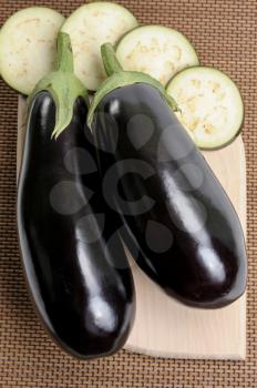 Royalty Free Photo of Two Eggplants and Slices