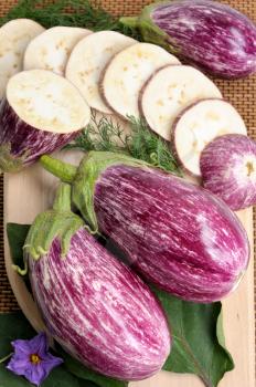 Royalty Free Photo of Sliced and Whole Eggplants