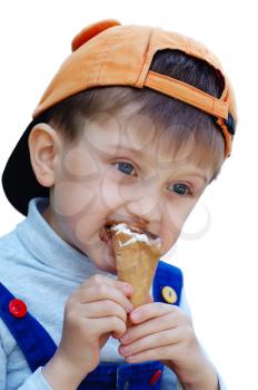 Royalty Free Photo of a Boy Eating an Ice-Cream Cone