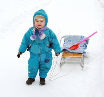 Royalty Free Photo of a Child With a Sled