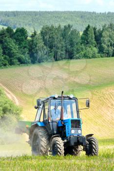 Royalty Free Photo of a Tractor on a Country Field