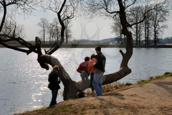 Royalty Free Photo of Young People at a Pond in Spring