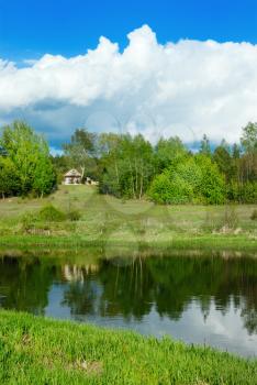 Royalty Free Photo of the River Vilija and a House
