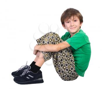 Sitting boy, isolated on a white background.