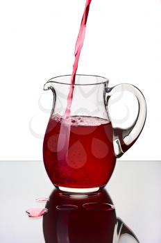 Glass pitcher, isolated on a white background.