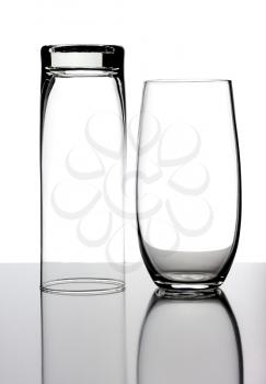 Two glasses, isolated on a white background.