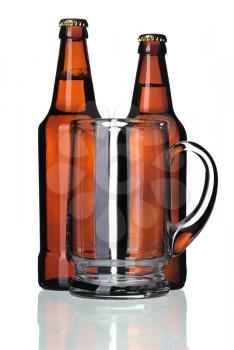Glass mug and two bottles of beer on a white background, isolated