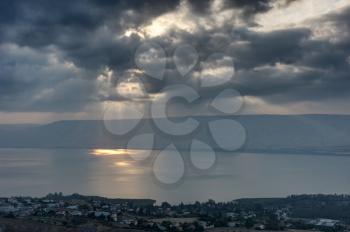 Lake Kinneret in the morning, sun rays are shining through the clouds 