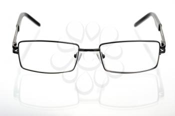 Rectangular glasses in a thin metal frame on a white background 