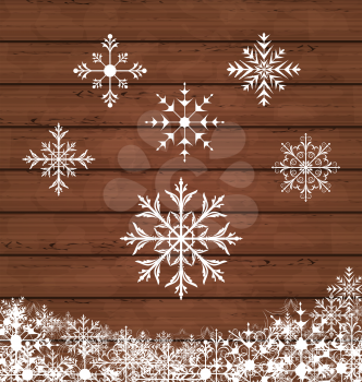 Illustration set snowflakes on wooden texture - vector