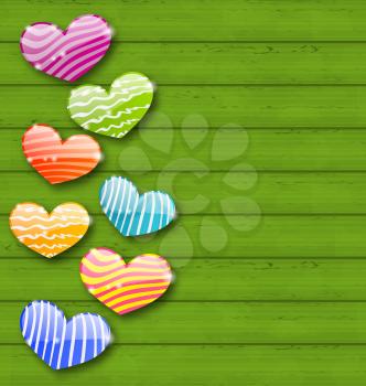 Illustration multicolored striped hearts on green wooden texture for Valentine Day - vector