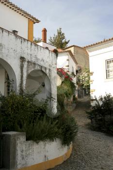 Royalty Free Photo of a Narrow Street in Obidos, Portugal