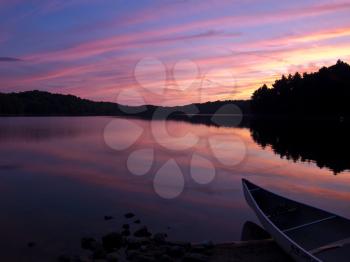 Sunset over forrest lake, Little Salmon lake in Frontenac Provintial Park, Ontario, Canada