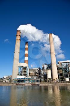 Industrial power plant with smokestack