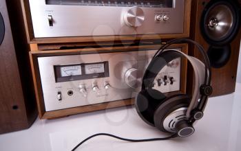 Royalty Free Photo of Headphones Connected to a Vintage Stereo