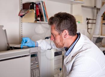 Scientist performs chromatograph mirror test