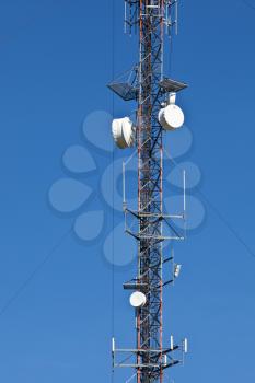 Cellular mobile radio transmission pole tower on the blue sky