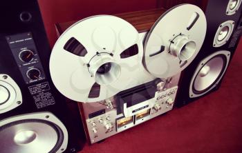 Analog Stereo Open Reel Tape Deck Recorder Vintage with Speakers Closeup