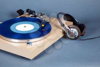 Analog Stereo Turntable Vinyl Record Player with Blue Disk and Headphones