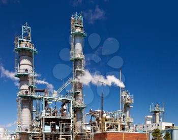 Refined Petroleum Petrochemical Plant Smokestack Pipeline with blue sky