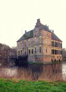 Ancient medieval stone fortress surrounded by water channel, castle Vorden, Netherlands, Europe