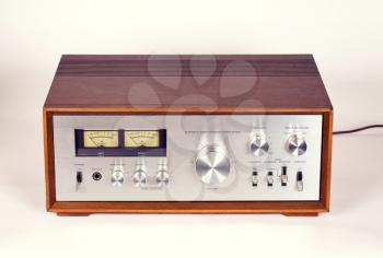 Vintage Stereo Audio Amplifier in Wooden cabinet frontal view