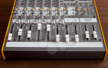Audio studio sound mixer equalizer board faders sliders, top frontal view

