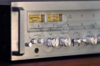 Vintage Stereo Receiver Front Panel with Controls Side View Closeup