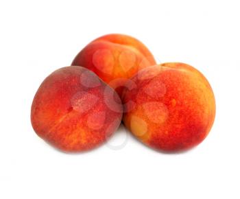 three peaches isolated on white