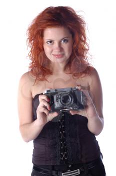 pretty red-haired girl with wintage photocamera