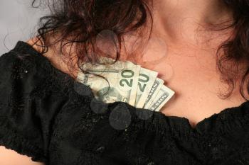 striptease - dollars in the decollete of the girl