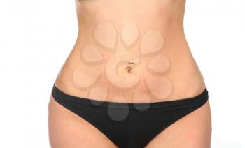 belly with piercing of girl in black swimsuit isolated on white