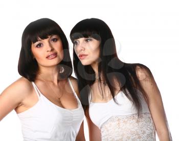 portrait of two sexy black haired girls isolated on white background