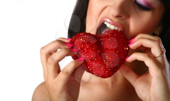 pretty girl is eating heart isolated on whit  background