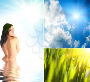 Beautiful young woman half in water against blue sky and sun