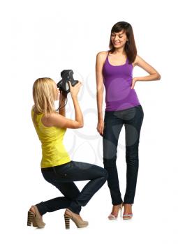 photographing - two girls make own snapshots isolated on white