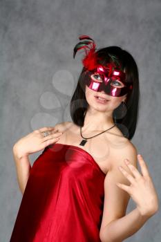 Beautiful brunette girl with Venice carnival mask