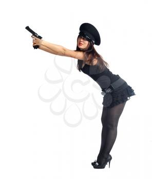 Sexy woman in police uniform with hand gun on white
