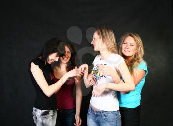 four 20-25 years women  friends having fun in studio