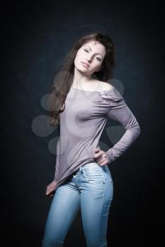 portrait of a young girl in sexual youth jeans