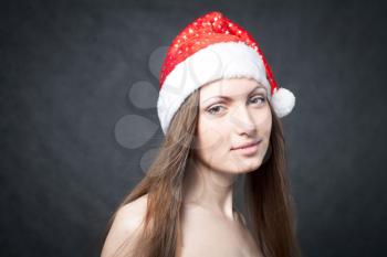 Mrs. Santa dreaming about Chrismas presents isolated on black background
