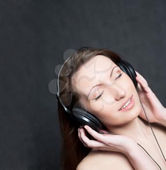 woman with headphones listening to music closed eyes