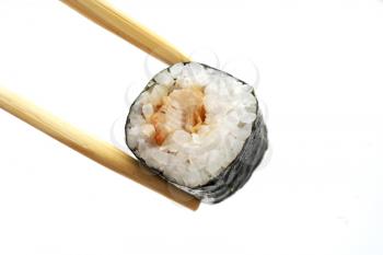 delicious sushi and chopsticks isolated on white