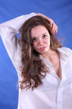 young woman portrait, studio shoot on blue