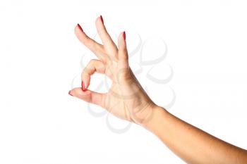 Female hand making OK sign  isolated on white