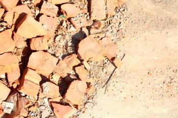 pattern of heap of used demolished red bricks